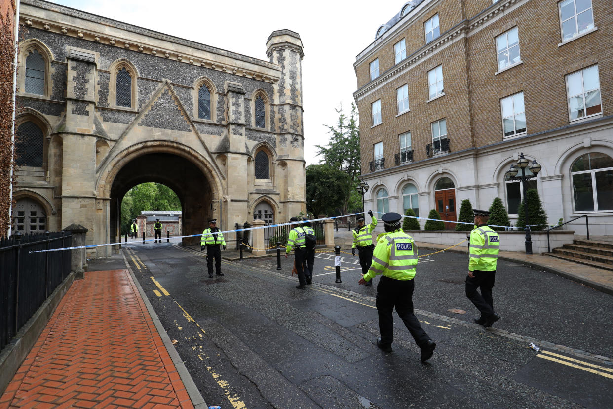 Police at the Abbey gateway of Forbury Gardens in Reading town centre following a multiple stabbing attack in the gardens which took place at around 7pm on Saturday leaving three people dead and another three seriously injured.