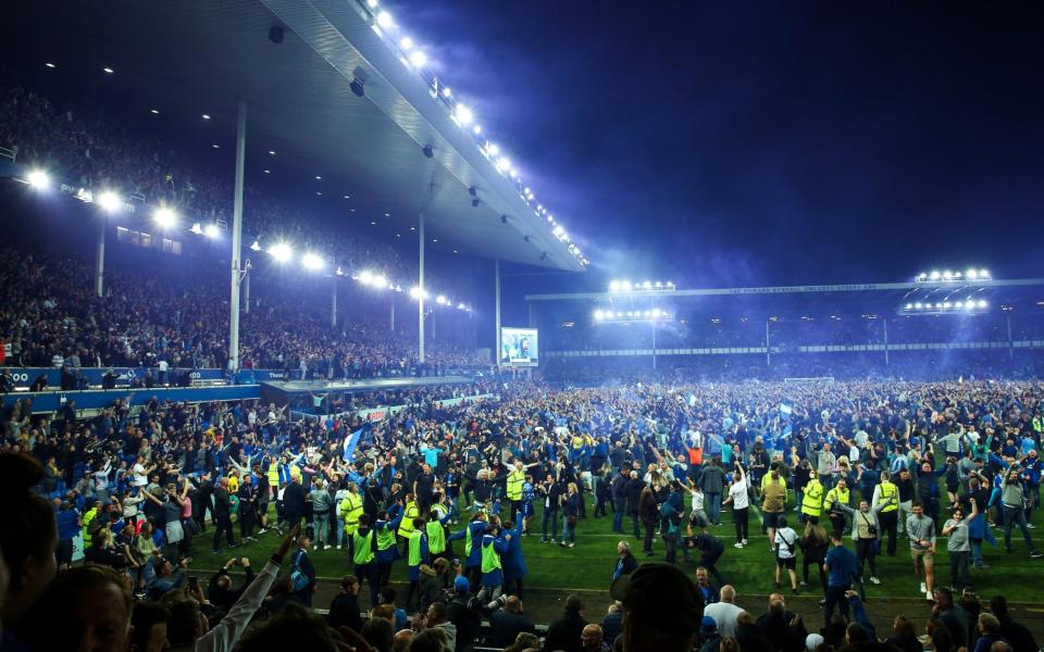 Fans of Everton celebrate with a pitch invasion as they avoid relegation during the Premier League match between Everton and Crystal Palace - Getty Images