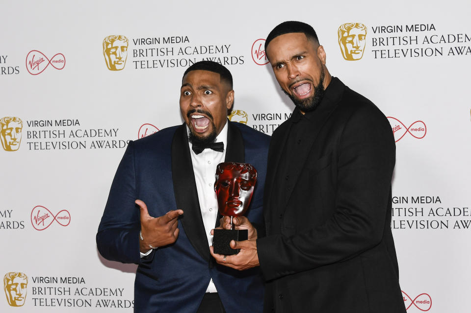 Jordan Banjo, left, and Ashley Banjo pose for photographers with their Must See Moment award in 'Britain's Got Talent' backstage at the British Academy Television Awards in London, Sunday, June 6, 2021. (AP Photo/Alberto Pezzali)