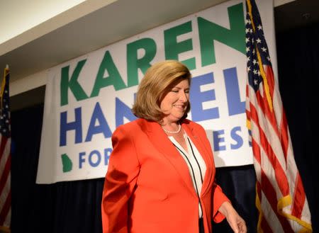 Karen Handel, Republican candidate for Georgia's 6th Congressional District, leaves after speaking to supporters during a brief appearance at her election night party at the Hyatt Regency at Villa Christina in Atlanta, Georgia, U.S., June 20, 2017. REUTERS/Bita Honarvar