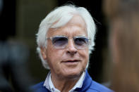 Trainer Bob Baffert speaks with reporters ahead of the 149th running of the Preakness Stakes horse race at Pimlico Race Course, Friday, May 17, 2024, in Baltimore. (AP Photo/Julia Nikhinson)