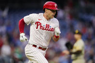 Philadelphia Phillies' Rhys Hoskins, left, rounds the bases after hitting a home run against San Diego Padres pitcher Blake Snell during the third inning of a baseball game, Wednesday, May 18, 2022, in Philadelphia. (AP Photo/Matt Slocum)