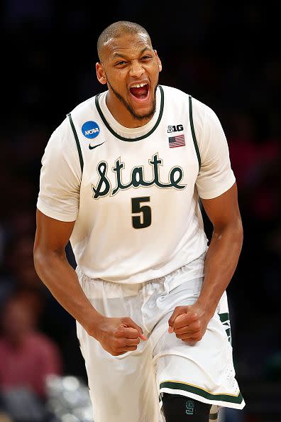 Adreian Payne #5 of the Michigan State Spartans reacts after a basket in the second half against the Connecticut Huskies during the East Regional Final of the 2014 NCAA Men's Basketball Tournament at Madison Square Garden on March 30, 2014 in New York City.  (Photo by Elsa/Getty Images)