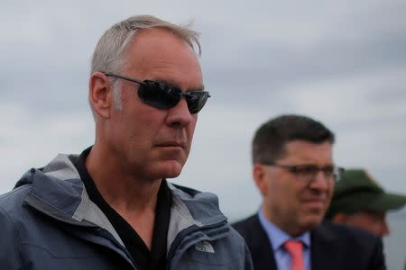 U.S. Interior Secretary Ryan Zinke rides a boat to Georges Island, while traveling for his National Monuments Review process, in Boston Harbor, Massachusetts, U.S., June 16, 2017. REUTERS/Brian Snyder