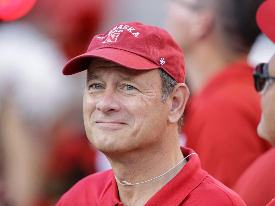 Chief Justice John Roberts visits the sidelines before an NCAA college football game between Nebraska and Miami in Lincoln, Neb., Saturday, Sept. 20, 2014.