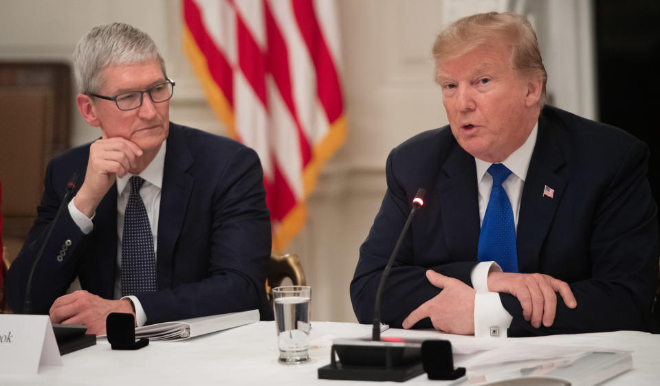 US President Donald Trump speaks alongside Apple CEO Tim Cook (L) during the first meeting of the American Workforce Policy Advisory Board in the State Dining Room of the White House in Washington, DC, March 6, 2019. (Photo by SAUL LOEB / AFP)        (Photo credit should read SAUL LOEB/AFP/Getty Images)