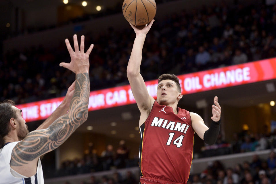 Miami Heat guard Tyler Herro (14) shoots against Memphis Grizzlies center Steven Adams in the second half of an NBA basketball game, Monday, Dec. 5, 2022, in Memphis, Tenn. (AP Photo/Brandon Dill)