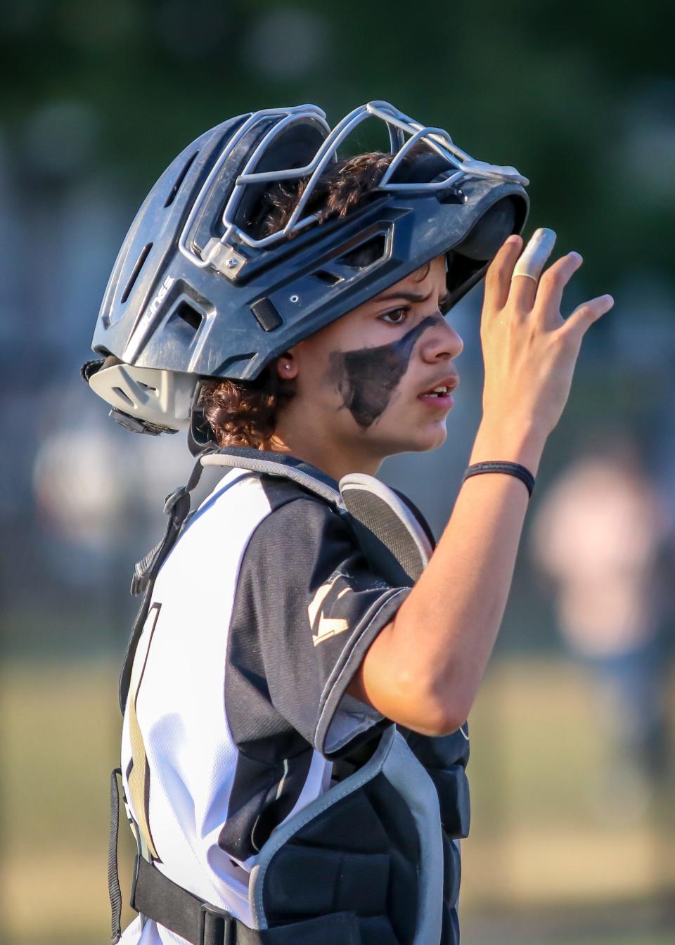 A.C.G. catcher Owen Rene looks at his teams defensive positioning during his teams game against Wonder Bowl on Thursday night at Whaling City Youth Baseball League in New Bedford.