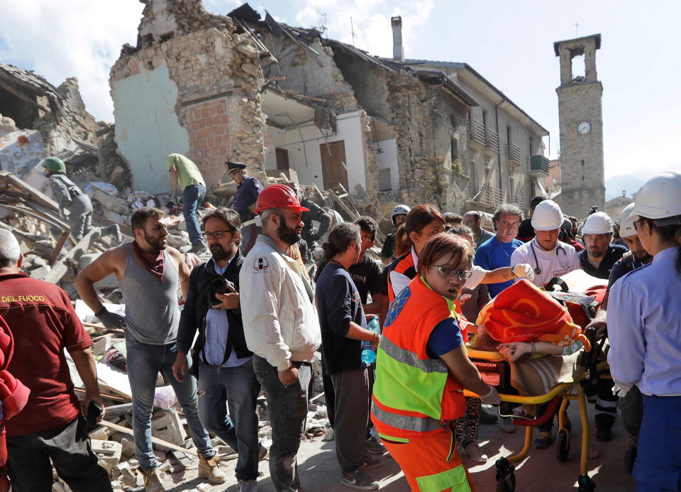 <p>A victim is pulled out of the rubble following an earthquake in Amatrice Italy, Wednesday, Aug. 24, 2016. (AP Photo/Alessandra Tarantino) </p>