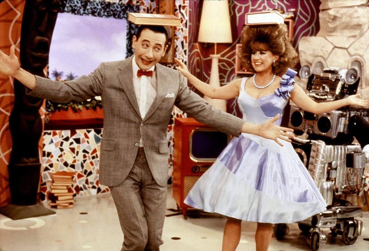 In a handout photo from the studio, Paul Reubens plays Pee Wee Herman and Lynne Stewart plays Miss Yvonne in a scene from the original television series "Pee Wee's Playhouse."