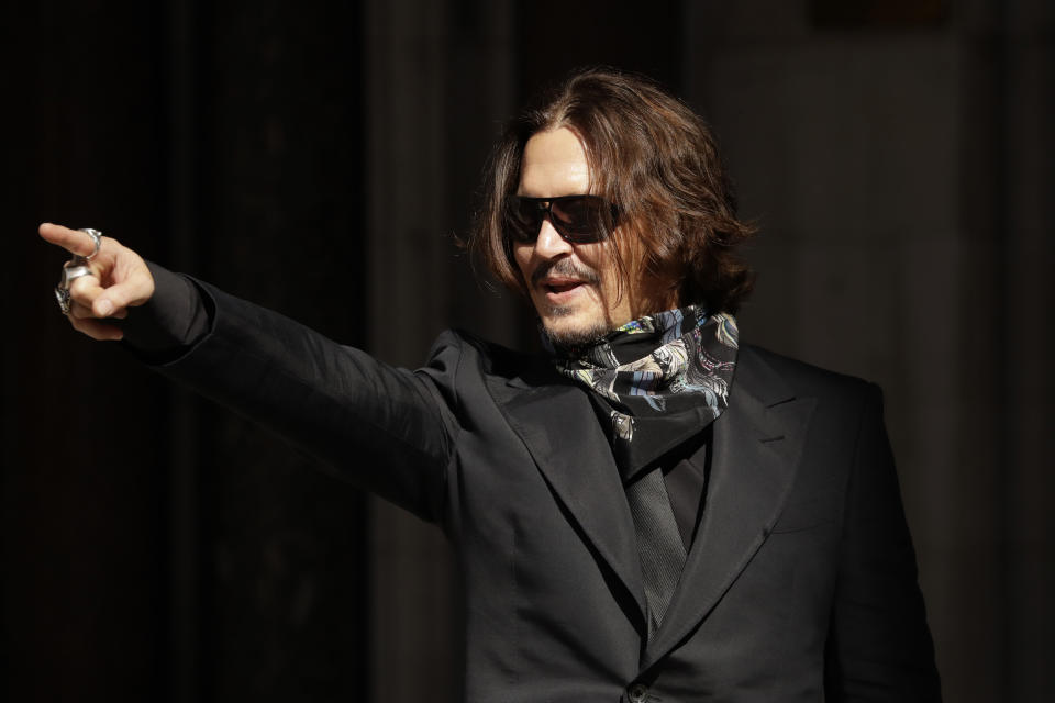 Actor Johnny Depp arrives at the High Court in London, in London, Monday, July 20, 2020. Amber Heard started Monday to give evidence at the High Court in London as part of Johnny Depp’s libel case against The Sun over allegations of domestic violence during the couple's relationship. (AP Photo/Matt Dunham)