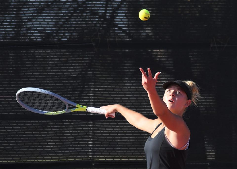 Lubbock-Cooper's Gracie Wood serves the ball in a first-round match at the Region I-5A tennis tournament Monday, April 10, 2023, at Texas Tech's McLeod Tennis Center.