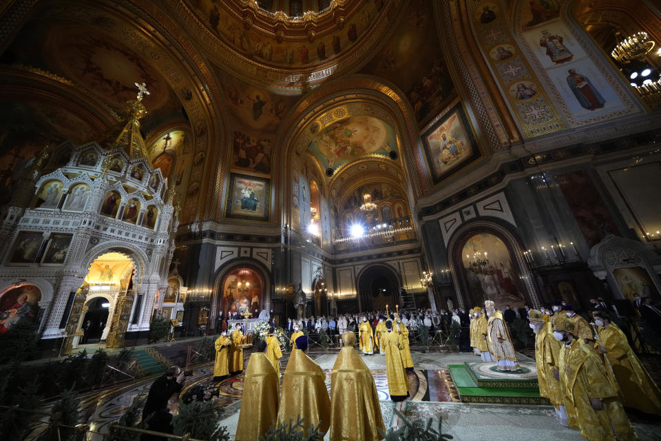 Russian Orthodox Patriarch Kirill delivers the Christmas Liturgy in the Christ the Saviour Cathedral in Moscow, Russia, Thursday, Jan. 6, 2022. Parishioners wearing face masks to protect against coronavirus, observed social distancing guidelines as they attended the liturgy Orthodox Christians celebrate Christmas on Jan. 7, in accordance with the Julian calendar. (AP Photo/Alexander Zemlianichenko)