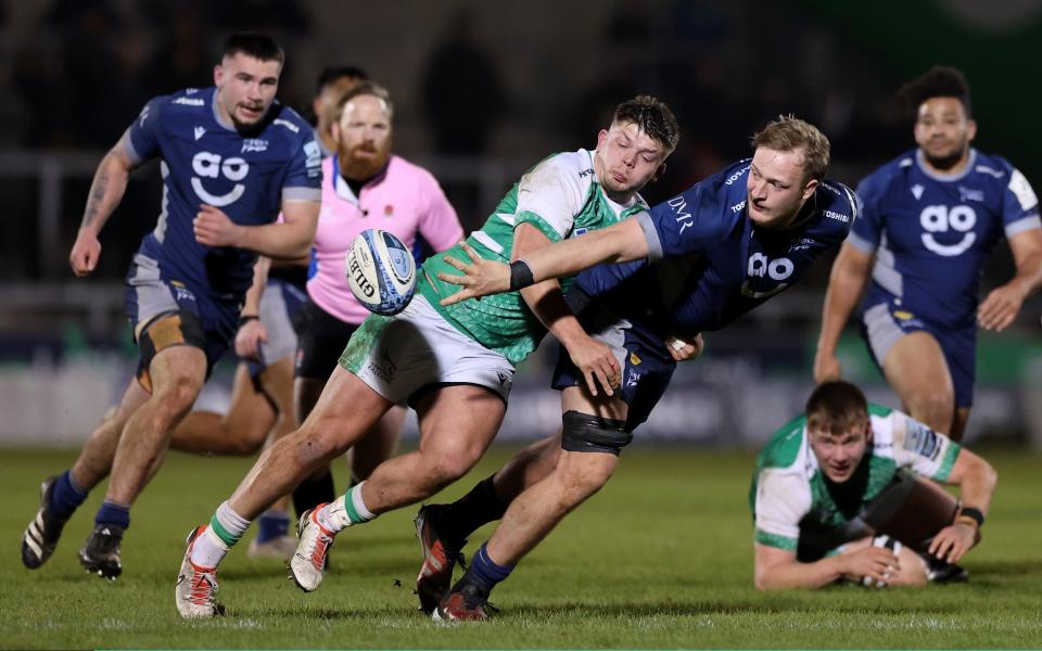 Ben Bamber of Sale Sharks runs is tackled by Jamie Blamire of Newcastle Falcons during a Club Friendly match between Sale Sharks and Newcastle Falcons at AJ Bell Stadium on March 08, 2024 in Salford, England