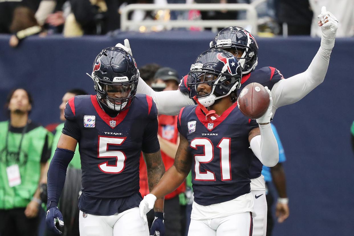 HOUSTON, TEXAS - OCTOBER 15: Steven Nelson #21 of the Houston Texans celebrates with Jalen Pitre #5 and Jonathan Greenard #52 of the Houston Texans after an interception during the fourth quarter against the New Orleans Saints at NRG Stadium on October 15, 2023 in Houston, Texas. (Photo by Bob Levey/Getty Images)