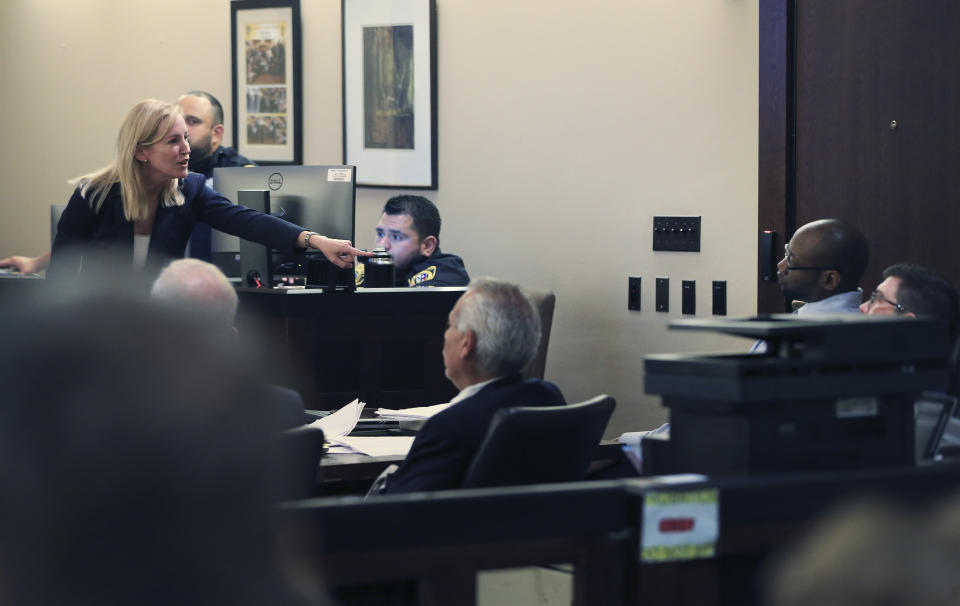 Prosecutor Tamara Strauch points to defendant Otis McKane during closing statements on day 11 of the McKane's capital murder trial for the 2016 shooting of SAPD detective Benjamin Marconi on Monday, July 26, 2021. (Kin Man Hui/The San Antonio Express-News via AP)