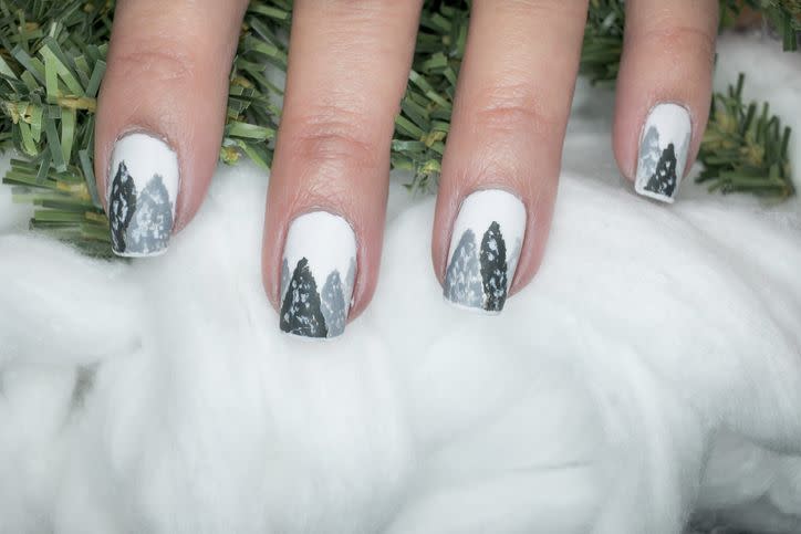 seasonal inspired nail art with trees and snowfall