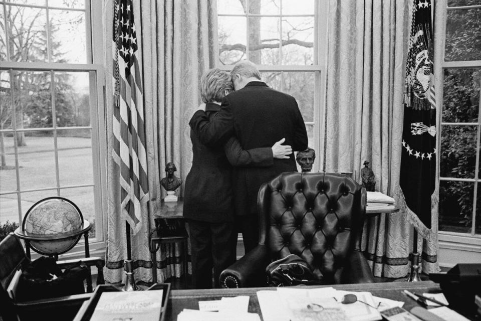 The President and the First Lady Share a private moment, one of their last in the Oval Office. Jan. 11, 2001.