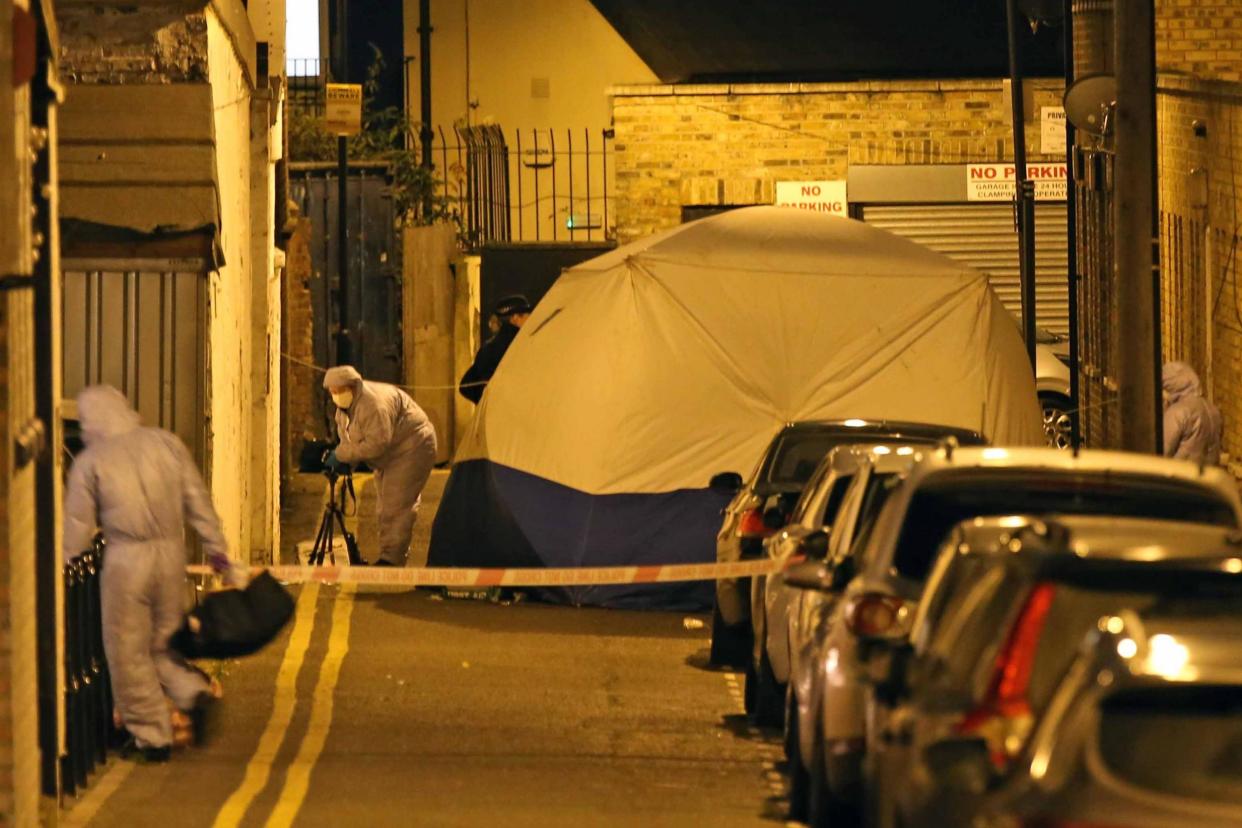A forensic tent was seen in place at the scene in Hackney: NIGEL HOWARD