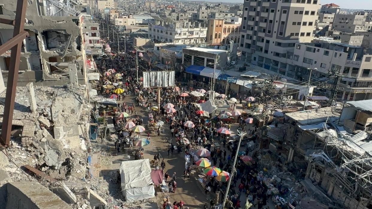 Palestinians at Nuseirat refugee camp doing their Ramadan shopping at the bazaar established between the destroyed buildings as Israeli attacks continue in Deir al-Balah, Gaza on March 13, 2024 (Photo by Doaa Albaz/Anadolu via Getty Images)