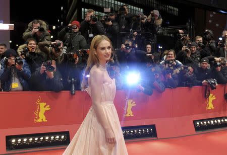 Actress Lily James arrives for the screening of the movie 'Cinderella' at the 65th Berlinale International Film Festival in Berlin February 13, 2015. REUTERS/Stefanie Loos