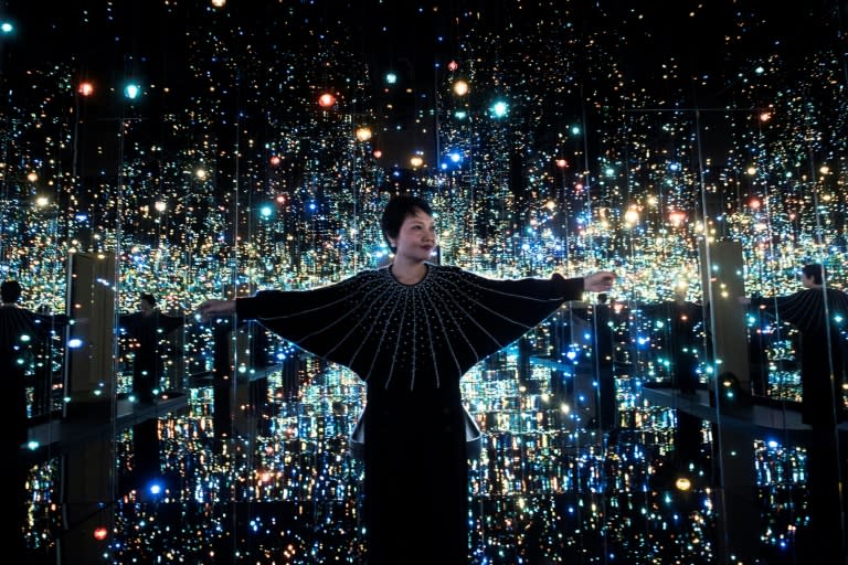 Yayoi Kusama's Infinity Mirrors exhibition curator Mika Yoshitake poses its the Souls of Millions of Light Years Away at the Hirshhorn Museum February 21, 2017 in Washington, DC