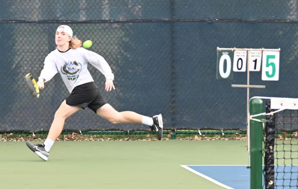 Lexington's Karl Etzel chases down a shot during an early-season match this spring.