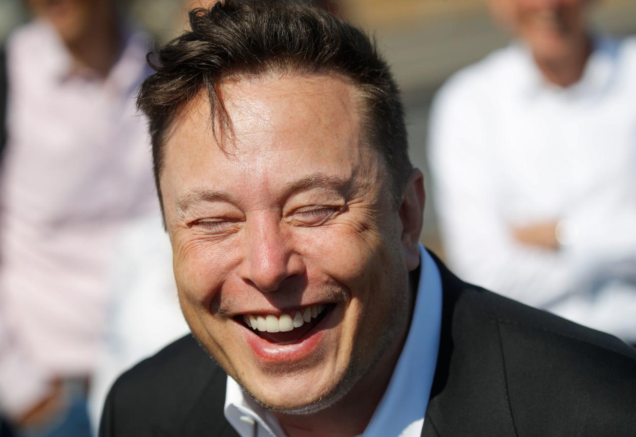 Tesla CEO Elon Musk laughs as he talks to media as he arrives to visit the construction site of the future US electric car giant Tesla, on September 03, 2020 in Gruenheide near Berlin. - Tesla builds a compound at the site in Gruenheide in Brandenburg for its first European "Gigafactory" near Berlin. (Photo by Odd ANDERSEN / AFP) (Photo by ODD ANDERSEN/AFP via Getty Images)