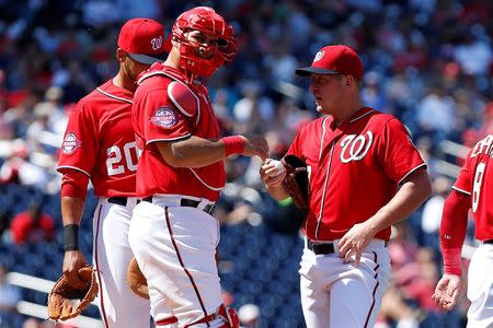 Aug 23, 2015; Washington, DC, USA; Washington Nationals starting pitcher Jordan Zimmermann (27) talks with Nationals catcher Wilson Ramos (40) against the Milwaukee Brewers in the fourth inning at Nationals Park. Mandatory Credit: Geoff Burke-USA TODAY Sports