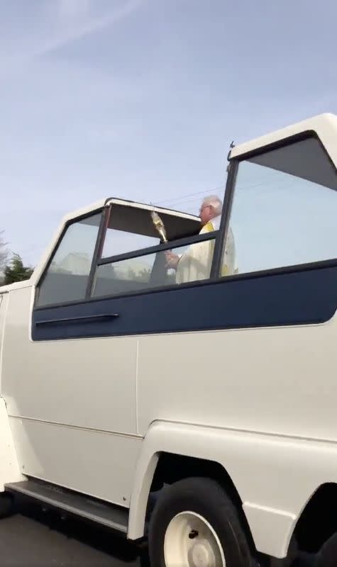 Irish priest spreads coronavirus Easter cheer from vintage 'popemobile'