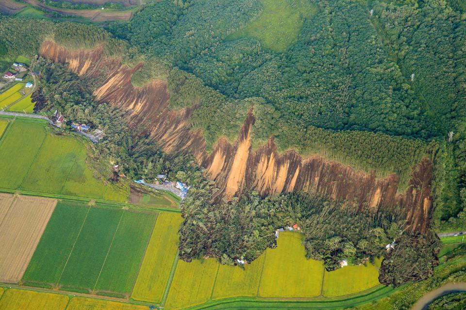 <p>The landscape appears destructed for miles due to the earthquake and landslides.</p>