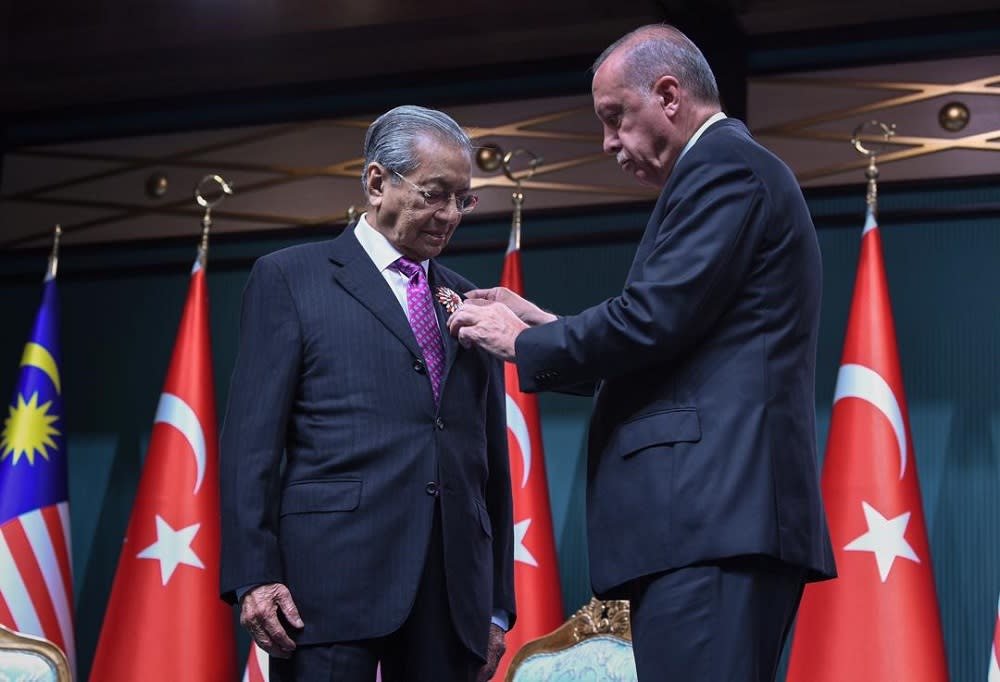 Tun Dr Mahathir Mohamad conferred the Order of the Republic by Turkish President Recep Tayyip Erdogan during a joint press conference at the Presidential Complex in Ankara July 25, 2019. — Bernama pic