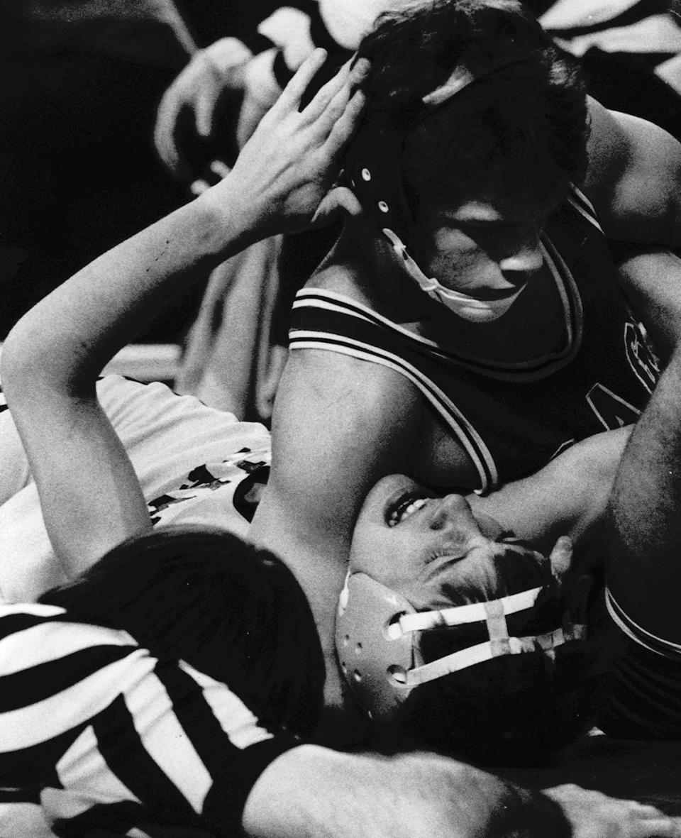 Osage's Mark Schwab is pictured in this 1984 photo pinning Steve Hamilton of Emmetsburg in the quarterfinals of the state tournament. Schwab became the head coach at North Iowa Area Community College.