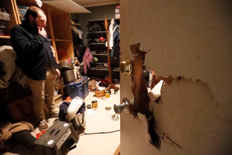 Coastal Heritage Society interpreter Alex Egart works to clean up the room where uniforms and other items were stored at Old Fort Jackson. 