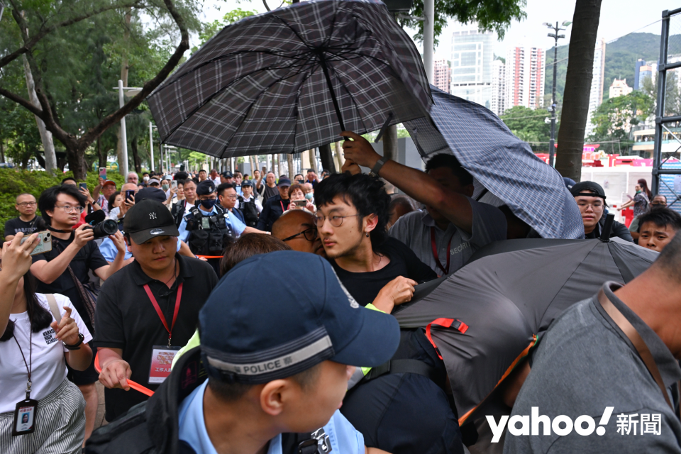 A man surrounded by police