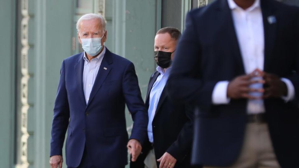 Wearing a face mask to reduce the risk posed by COVID-19, Democratic presidential nominee Joe Biden departs his live video campaign event Saturday in Wilmington, Delaware. (Photo by Chip Somodevilla/Getty Images)