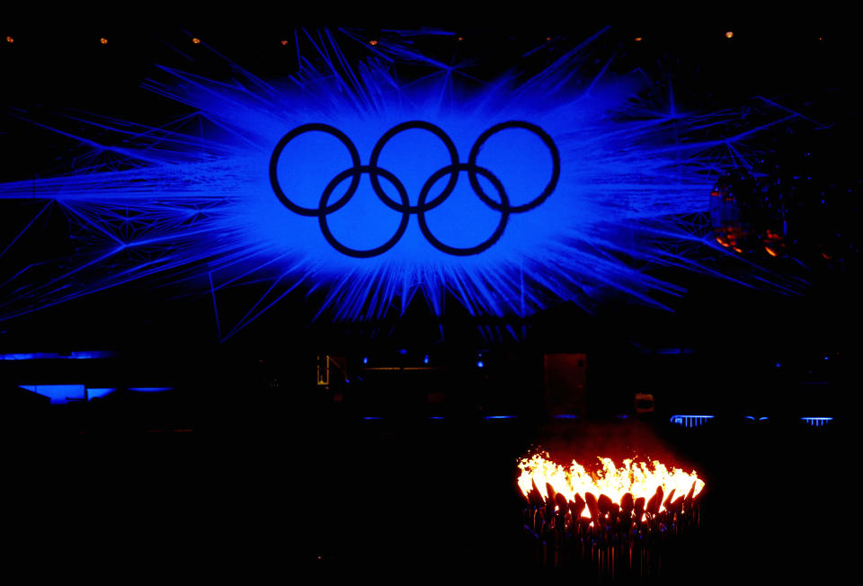 The Olympic Cauldron burns in front of the Olympic rings during the Closing Ceremony on Day 16 of the London 2012 Olympic Games at Olympic Stadium on August 12, 2012 in London, England. (Photo by Feng Li/Getty Images)