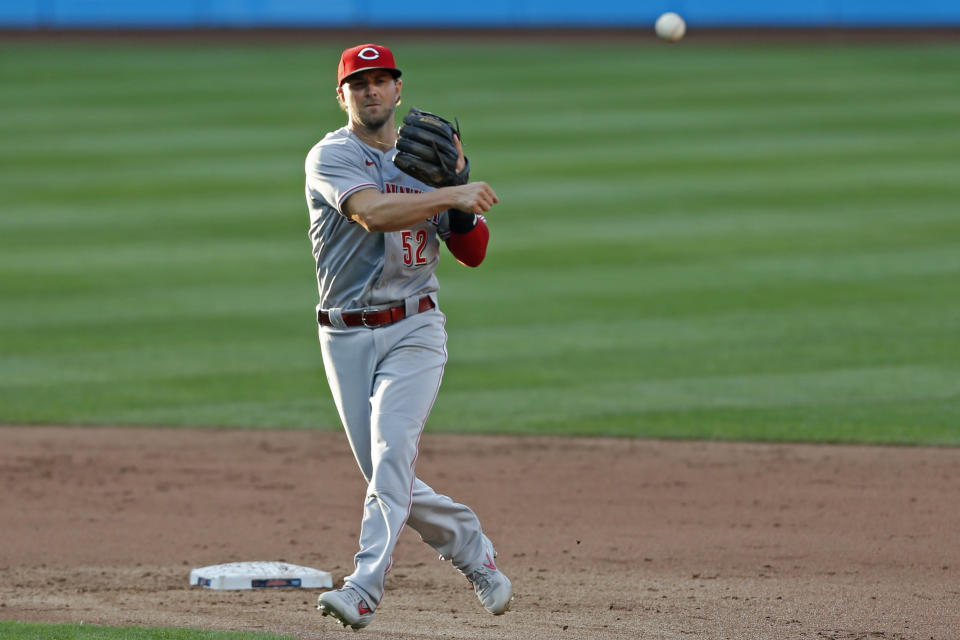 Cincinnati Reds' Kyle Farmer throws out Cleveland Indians' Beau Taylor during the fifth inning of a baseball game at Progressive Field, Thursday, Aug. 6, 2020, in Cleveland. (AP Photo/David Dermer)