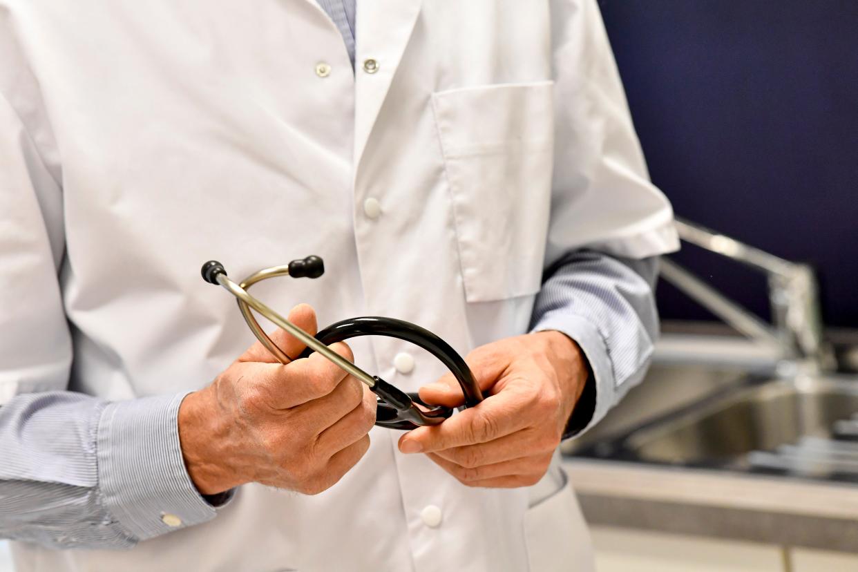 Illustration shows a close up on a doctor holding his stethoscope during a consultation in a group medical practice of general practitioners in Ronse, Monday 27 April 2020. BELGA PHOTO DIRK WAEM (Photo by DIRK WAEM/BELGA MAG/AFP via Getty Images)