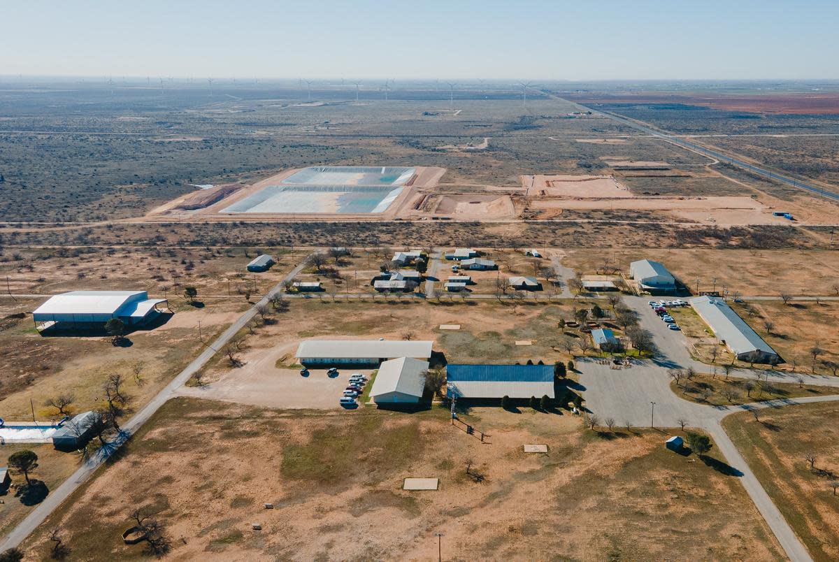 Circle 6 Baptist Camp, bottom, and produced water ponds, constructed by Martin Water, top, in Lenorah on Feb. 24, 2024. The Railroad Commission approved the construction of the ponds, used to treat and recycle produced water from fracking, next to the Circle 6 Baptist Camp in the Permian Basin.