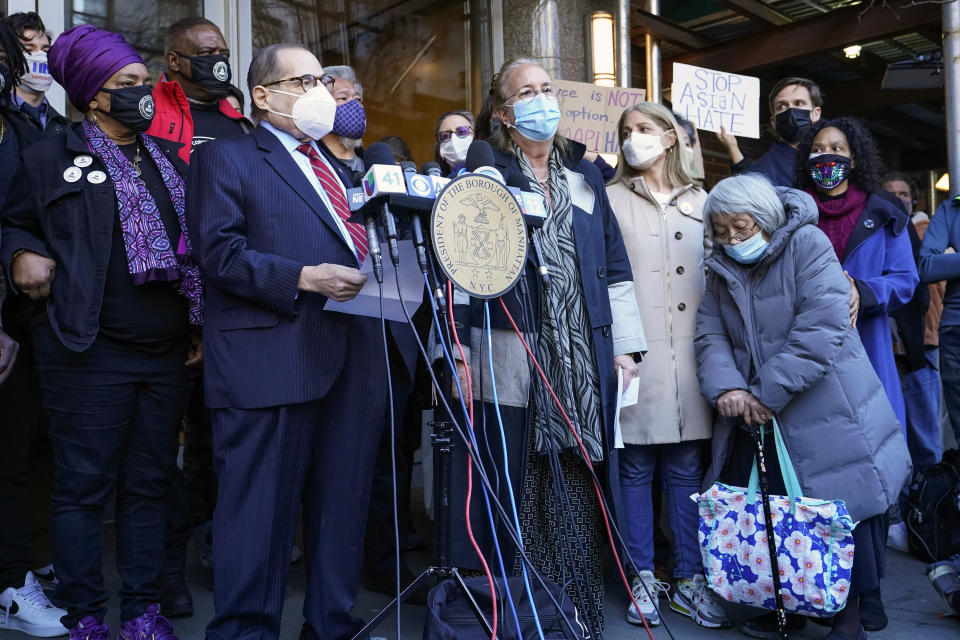 Rep. Jerrold Nadler, D-N.Y., at podium left, and Manhattan Borough President Gale Brewer are joined by community activists during a news conference on the sidewalk where an Asian American woman was attacked, Tuesday, March 30, 2021, in New York. The New York City Police Department says an Asian American woman was attacked by a man Monday afternoon who repeatedly kicked her in front of witnesses who seemingly stood by. (AP Photo/Mary Altaffer)