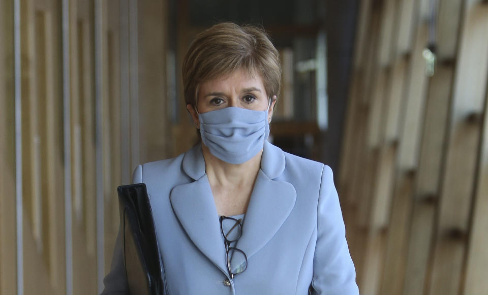 EDINBURGH, SCOTLAND - SEPTEMBER 01: Scottish First Minister Nicola Sturgeon arrives to update MSPs on Covid-19 restrictions at Scottish Parliament on September 01, 2021, in Edinburgh, Scotland. At the end of the month, Scottish government plans to introduce vaccine passports as a requirement for entry into nightclubs, adult entertainment venues and some live music events. (Photo by Fraser Bremner - Pool/Getty Images)