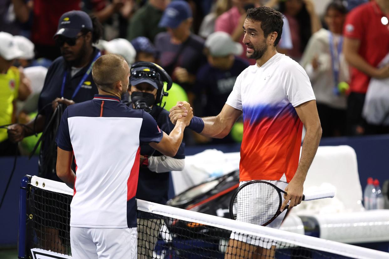 Marin Cilic of Croatia shakes hands after defeating Daniel Evans of Great Britain during their Men's Singles Third Round match on Day 6 of the 2022 U.S. Open at USTA Billie Jean King National Tennis Center on Sept. 3, 2022, in Flushing, Queens.