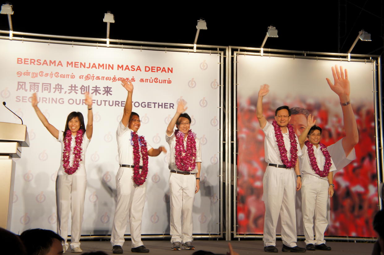Despite winning East Coast GRC, Minister Lim Swee Say (centre) says concerns remain. (Yahoo! photo/Alicia Wong)