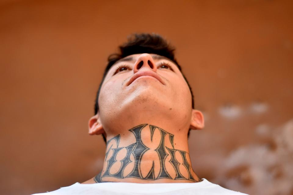 An ex member of the MS-13 gang is pictured at Santa Ana prison, 60 km northwest of San Salvador, on May 21, 2019. - Former members of Salvadoran gangs -mostly of the Mara Salvatrucha (MS-13) and Barrio 18- claim to be willing to endure a painful process with laser technology, that can take years, to erase tattoos they now say were a "youth mistake". (Photo by Oscar Rivera / AFP)        (Photo credit should read OSCAR RIVERA/AFP/Getty Images)