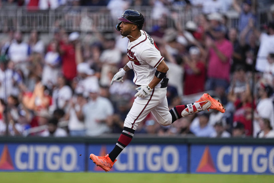 Atlanta Braves' Eddier Rosario runs the bases after hitting a two-run home run against the New York Yankees during the second inning of a baseball game Wednesday, Aug. 16, 2023, in Atlanta. (AP Photo/John Bazemore)