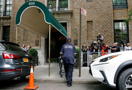 A medical examiner arrives at the front entrance to the Park Avenue apartment of designer Kate Spade in New York, U.S. June 5, 2018. REUTERS/Brendan McDermid
