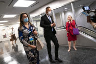 Peter Szijjarto, Hungary's minister of foreign affairs and trade, center, arrives for an interview with the Associated Press at United Nations headquarters, Thursday, Sept. 23, 2021, during the 76th Session of the U.N. General Assembly in New York. (AP Photo/John Minchillo)