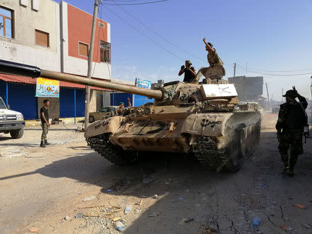 Troops from eastern Libyan forces are seen in Ain Zara, south of Tripoli, Libya April 11, 2019. Picture taken April 11, 2019. REUTERS/Stringer