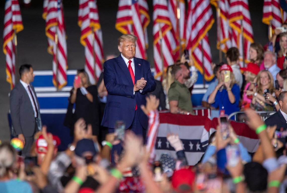 Former president Donald Trump throws takes the stage during a rally at Wilmington International Airport Friday, Sept. 23, 2023.